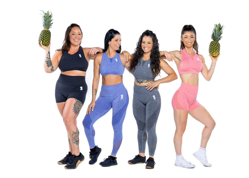 Group photo wearing black, blue, gray and pink sammy sports bras, leggings and shorts