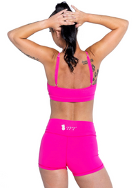 back view of arashi neon pink sports bra