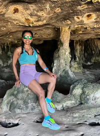 exploring caves in purple bike shorts