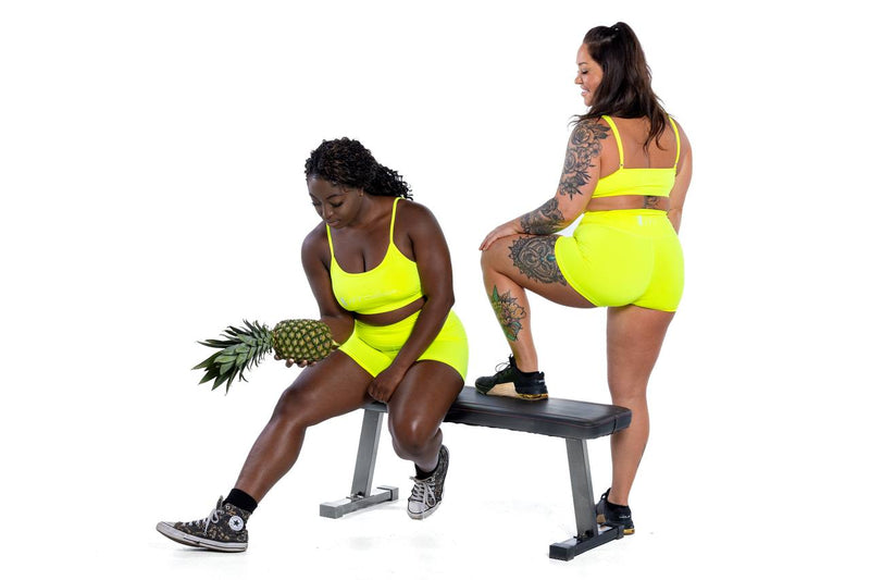 Group shot of women's palm beach yellow sports bra & short sets